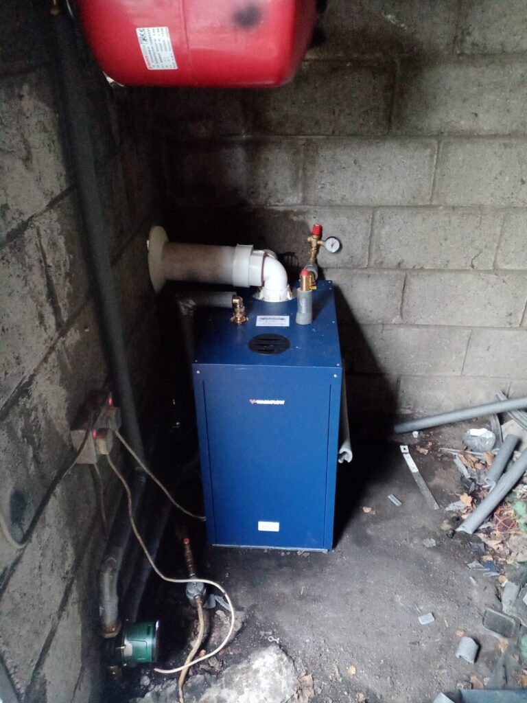 Outdoor Garage Located Warmflow New Oil Boiler Replacement - After Photo